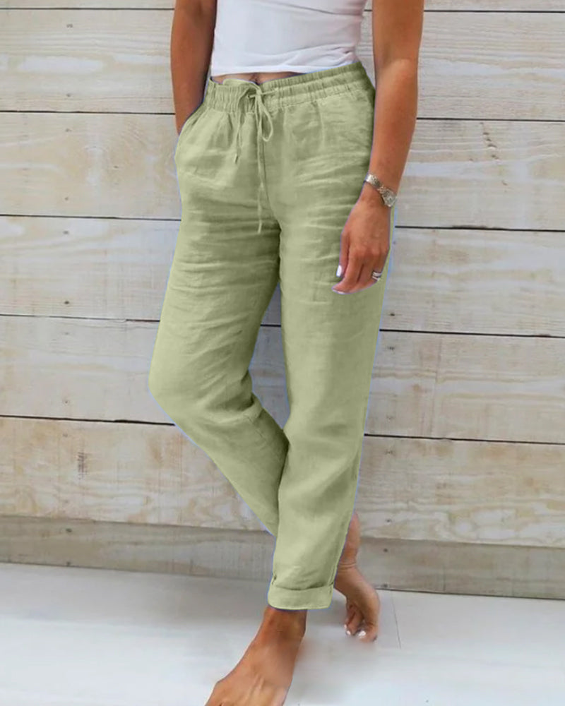 Stretchy lightweight casual trousers in green, front view