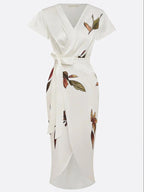 Women's floral leaf print wedding guest maxi dress, three-quarter view