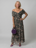 Off-shoulder flared midi dress styled for garden party, lifestyle shot