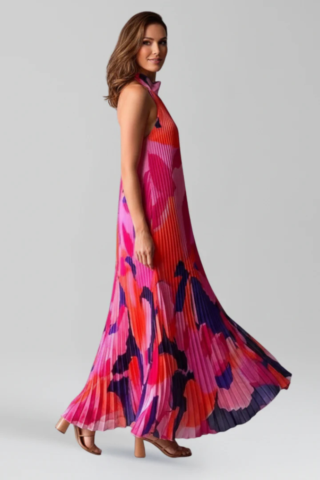 Women's wedding guest maxi dress with halter neck and vibrant floral print, styled look