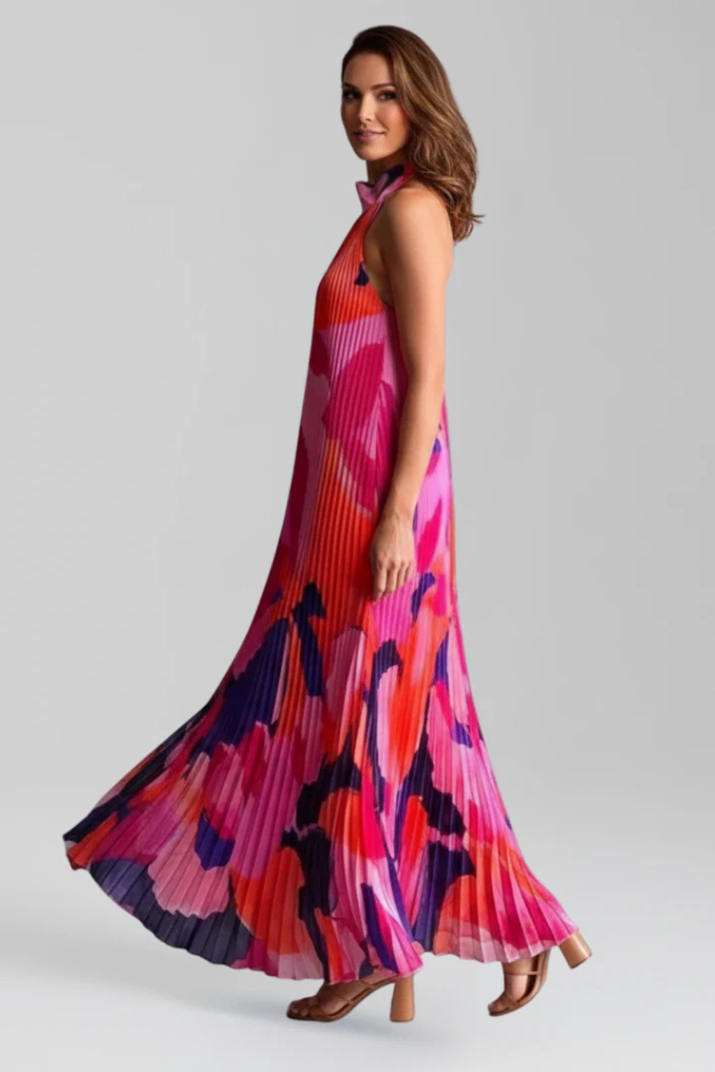 Women's halter neck maxi dress with vertical pleats and keyhole opening, side view