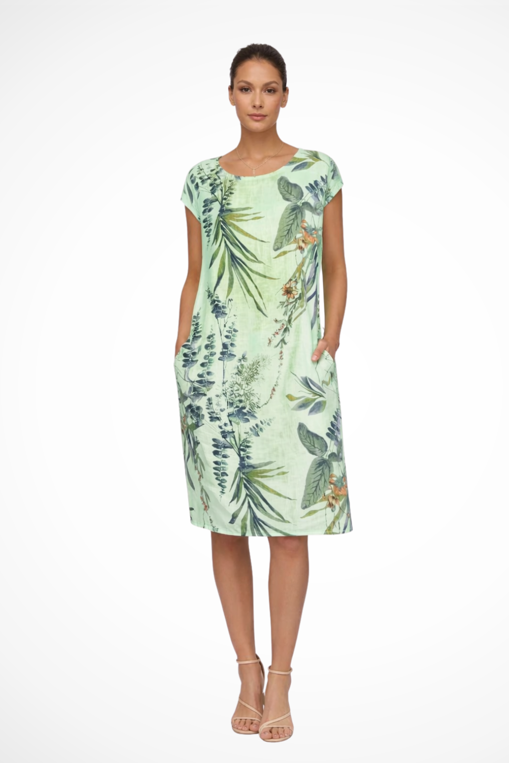Women's botanical print summer dress styled with sandals
