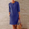 Women's cotton linen button-front shift dress with pockets in neutral colour, front view