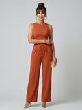 Sleeveless high neck top and trousers set in orange, full length view