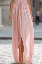 Women's pleated chiffon maxi dress with fabric waist tie and gathered collar, full length view
