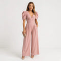 Women's wide leg puff sleeve jumpsuit in peach – full length front view