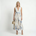 Women's floral pleated maxi dress in white – sleeveless V-neck front view