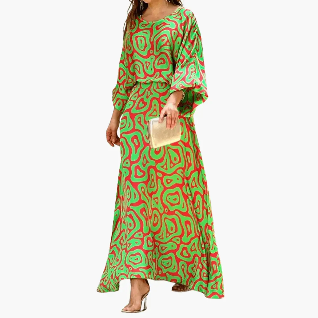 Women's boho print flowing maxi dress, vibrant summer wedding guest style, front view