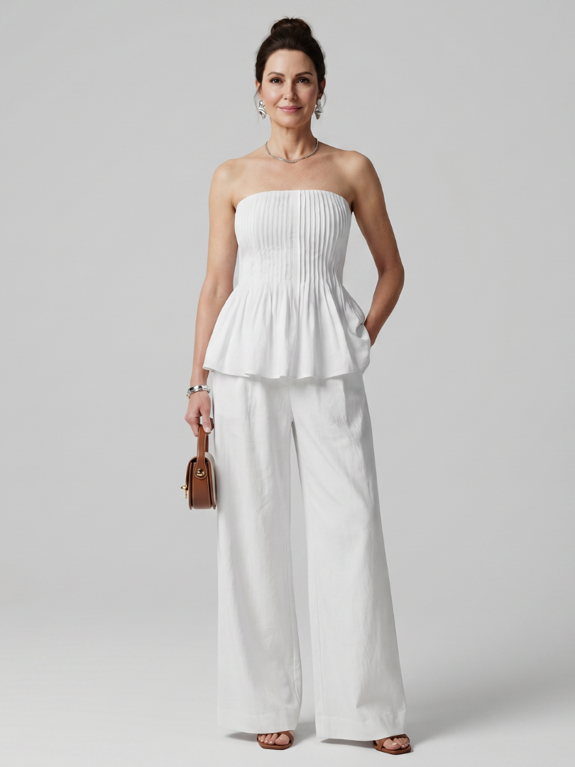 Women's strapless smocked peplum top and wide leg pants co-ord