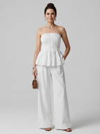 Women's strapless smocked peplum top and wide leg pants co-ord