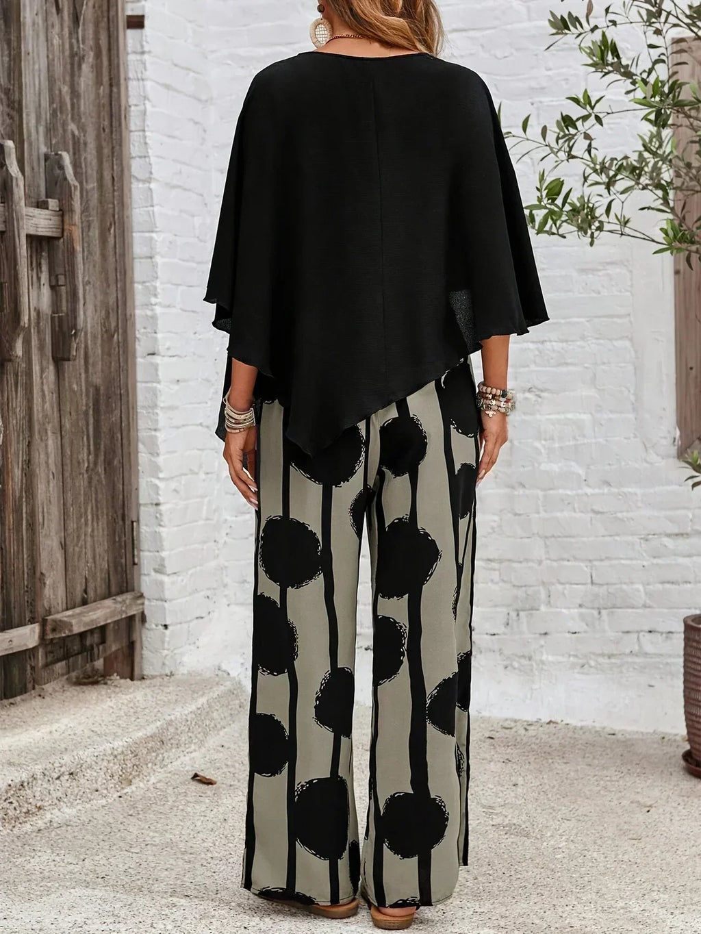 Women's knit co-ord set in black and grey, styled on model