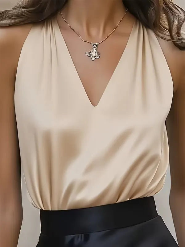 Women's elegant satin camisole blouse styled for evening occasion