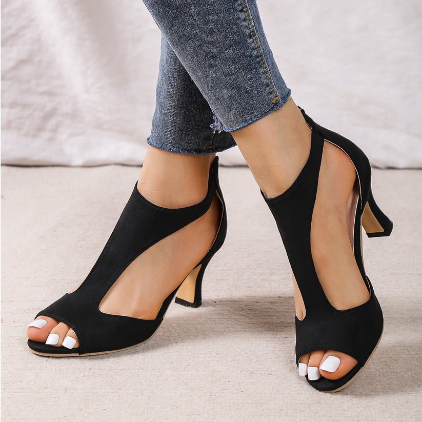 Heeled sandals side profile view supportive design