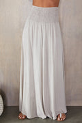 Wide leg smocked waist trousers in beige, front view