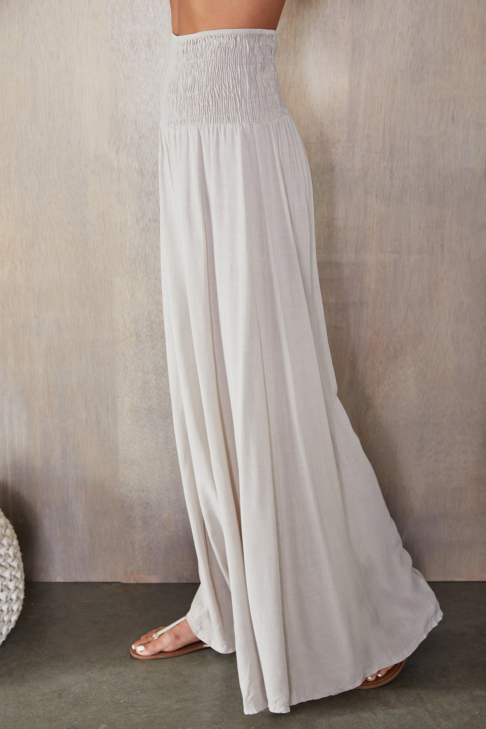Women's wide leg smocked waist trousers, back view