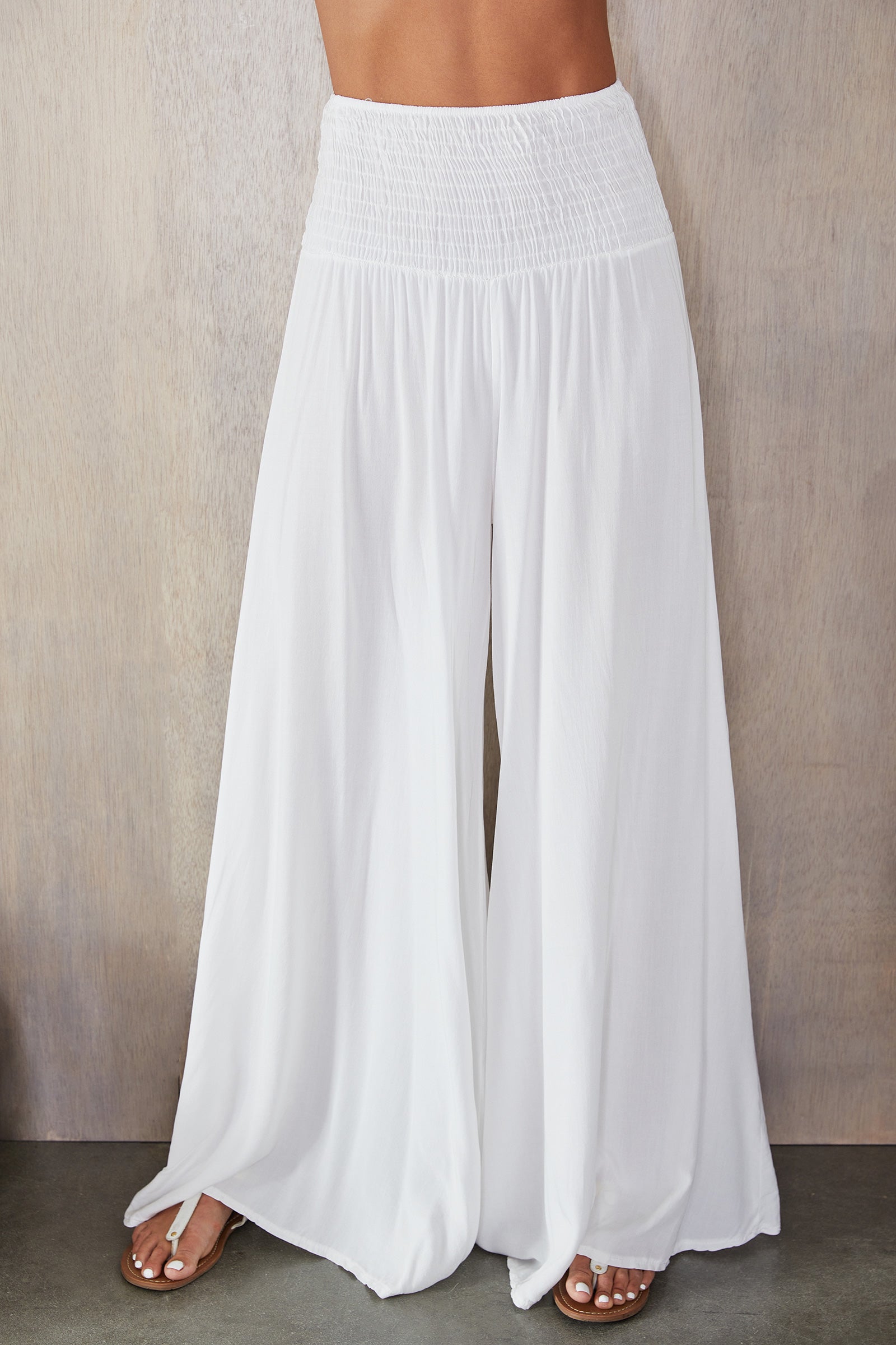 Women's wide leg smocked waist trousers, close up of fabric texture