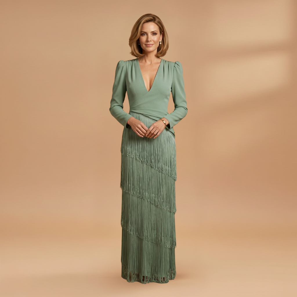 Front view of women's pleated tassel dress with V-neckline