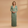 Front view of women's pleated tassel dress with V-neckline