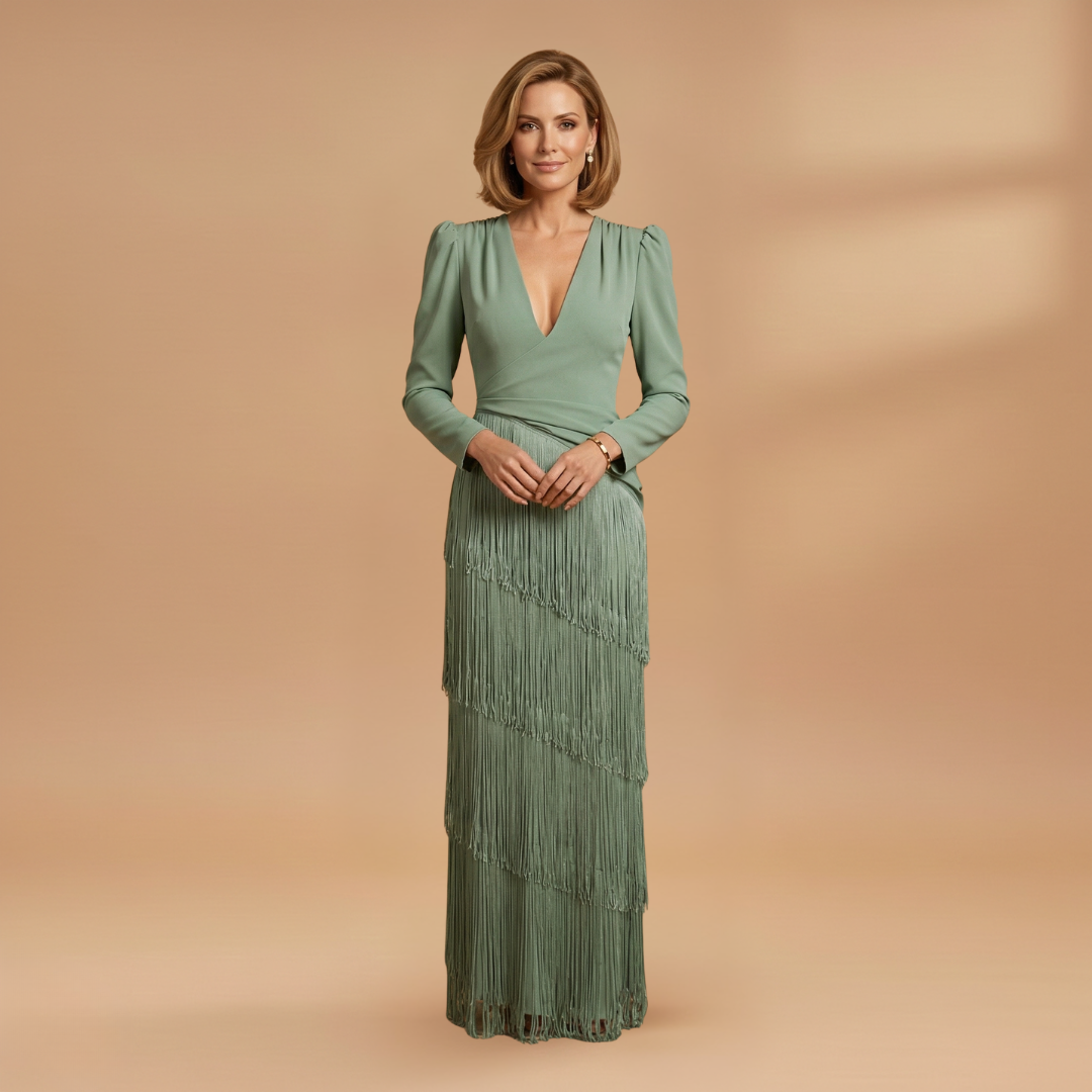Front view of women's pleated tassel dress with V-neckline