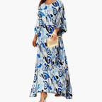 Women's bohemian print maxi dress showing elegant flowing silhouette, side view