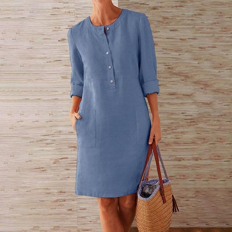 Women's cotton linen shift dress showing three-quarter sleeves and crew neckline detail