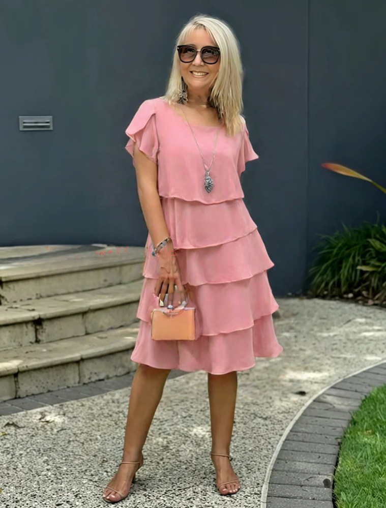 Layered midi dress styled with heels, elegant occasion look