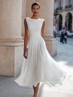 Sleeveless pleated midi dress in white, full length wedding guest view