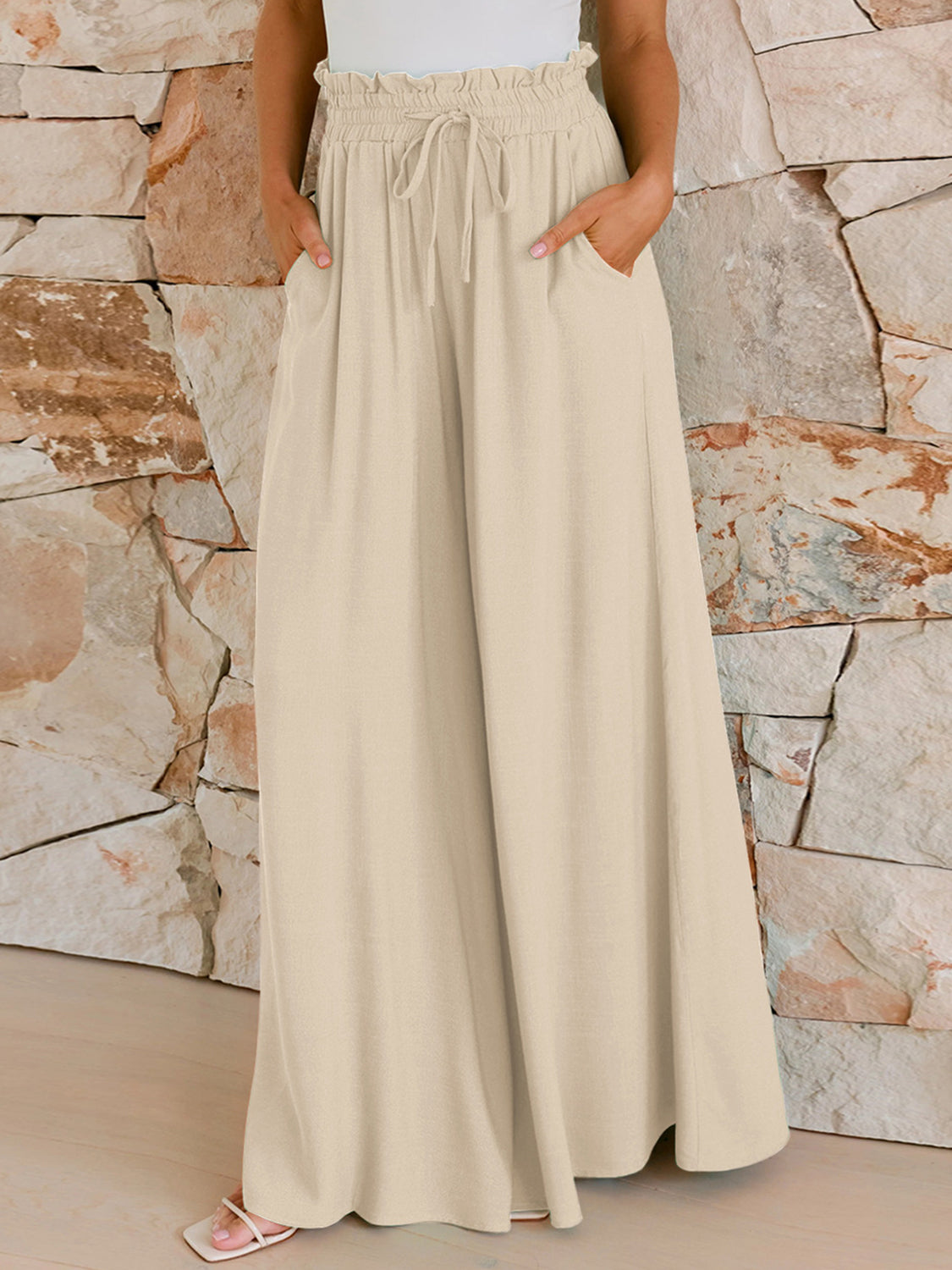 Women's wide leg pants detail showing drawstring waist