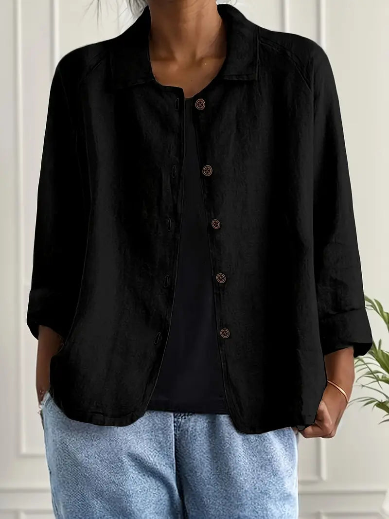 Close-up of button detail on women's lightweight summer jacket