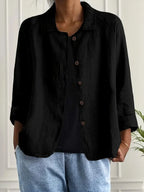 Close-up of button detail on women's lightweight summer jacket