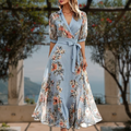 Women's floral flowing maxi dress in vibrant print, elegant wedding guest style, front view