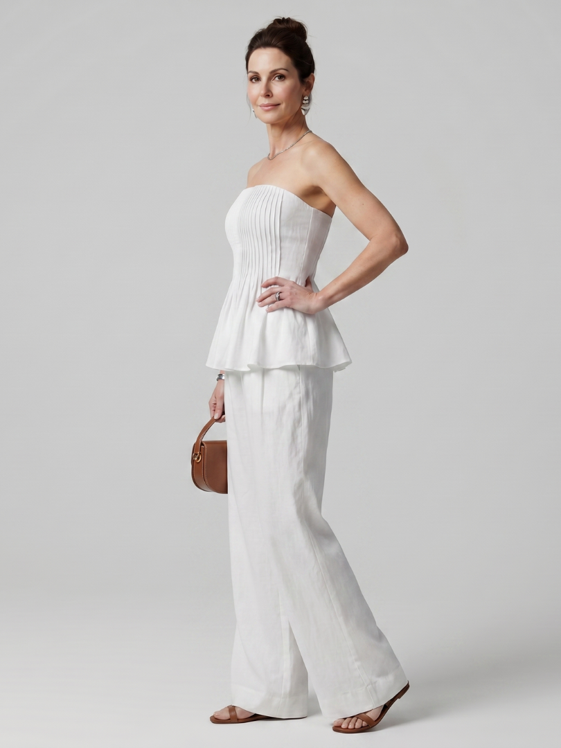 Front view of women's elegant smocked peplum two-piece set
