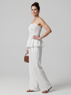 Front view of women's elegant smocked peplum two-piece set