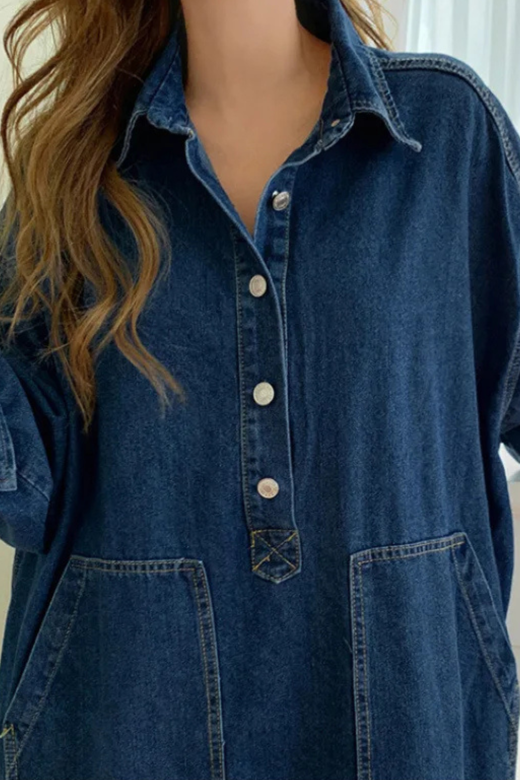 Women's denim maxi dress with button-front detail and oversized collar, close-up