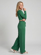 Front view of women's long sleeve crop top with wide leg trousers