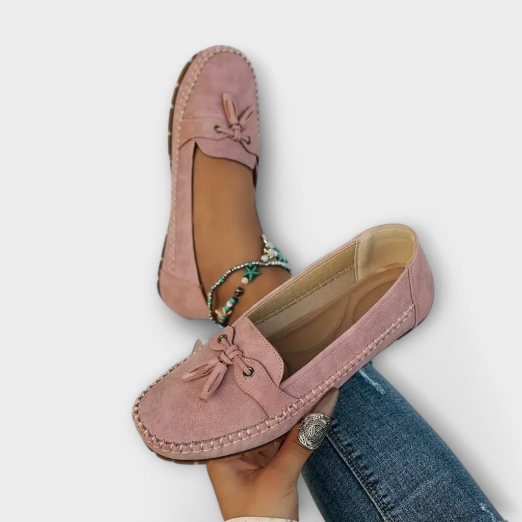 Side view of women's grey-green suede moccasin flat loafers