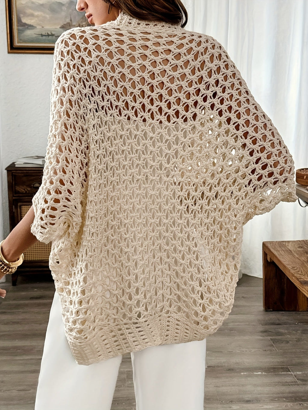 Women's crochet knit cardigan in beige, side view