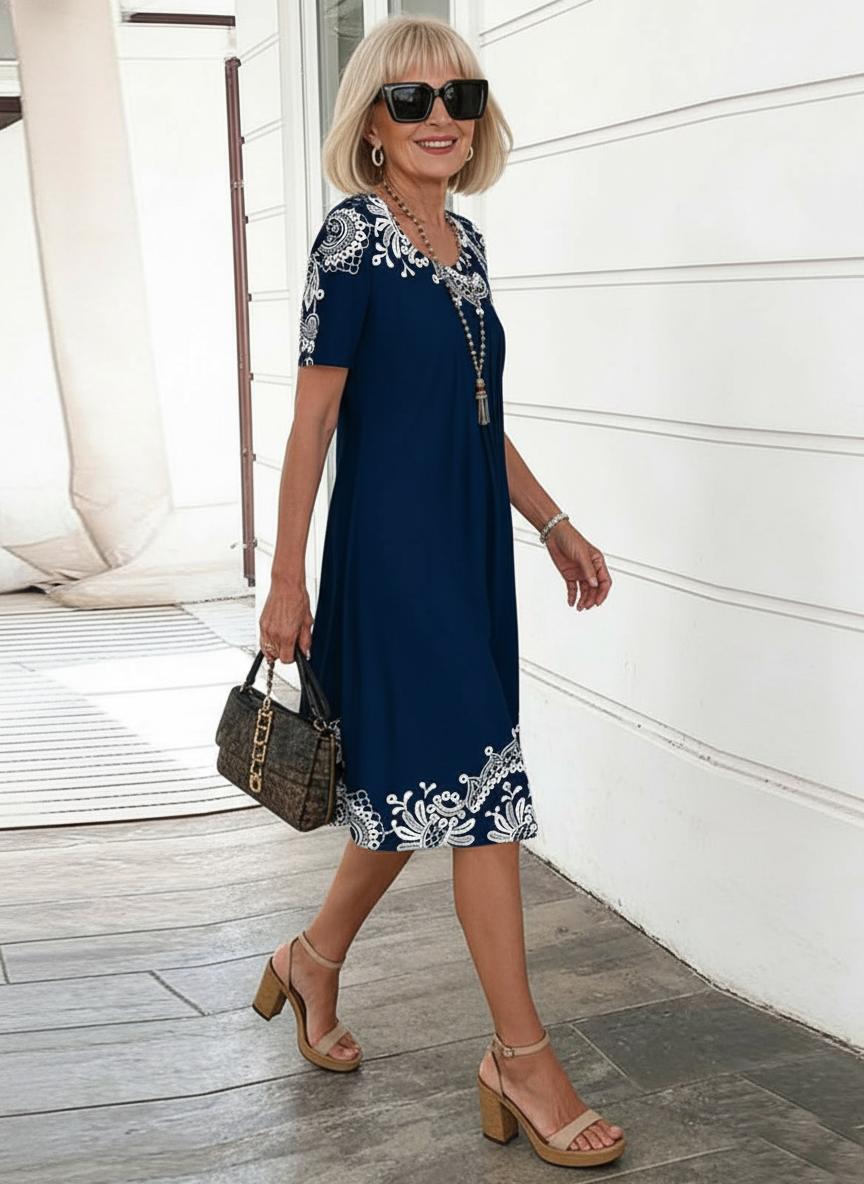 Women's navy floral print short sleeve A-line midi dress, side view