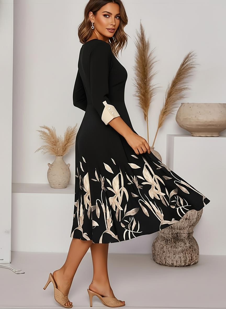 Black floral A-line midi dress, three-quarter view fitted bodice