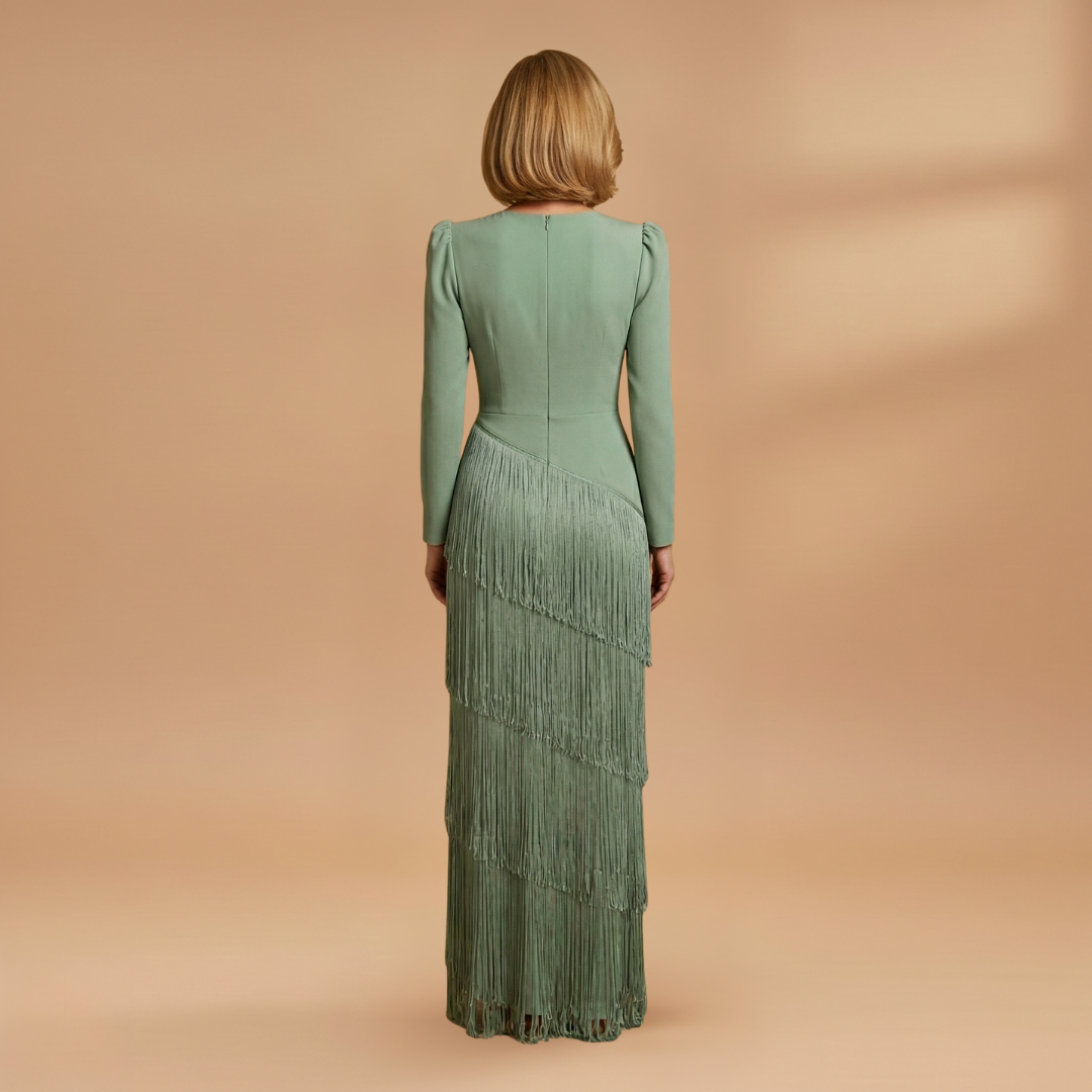 Close-up of pleated tassel hem on women's elegant evening dress
