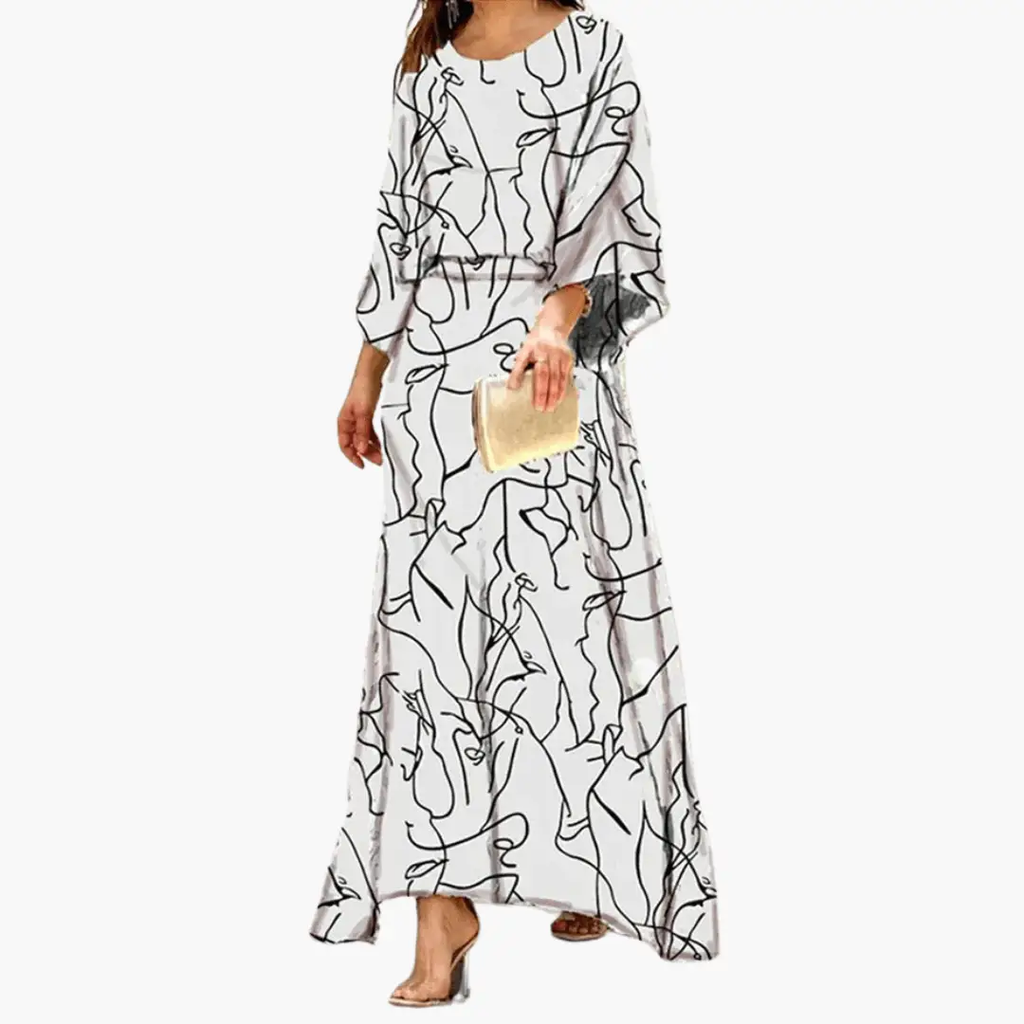 Women's flowing boho print maxi dress styled for a garden party occasion