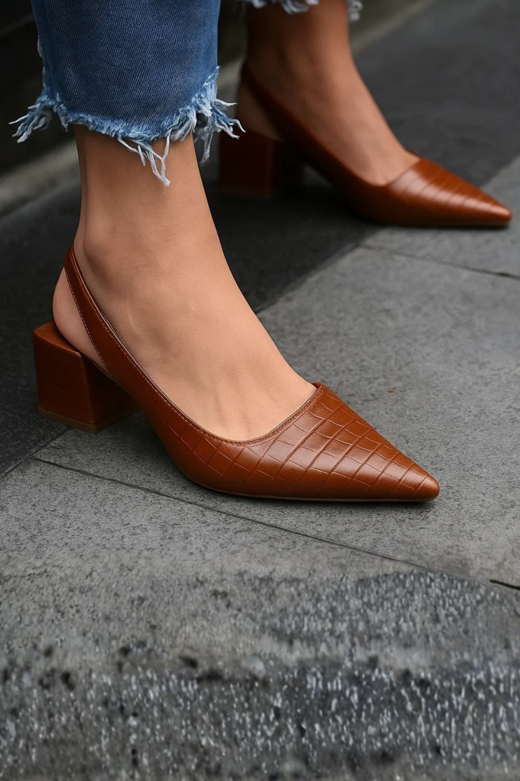Women's pointed toe low heel slingback pumps, pair view on white background