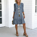 Women's blue floral print V-neck ruffle hem midi dress, front view