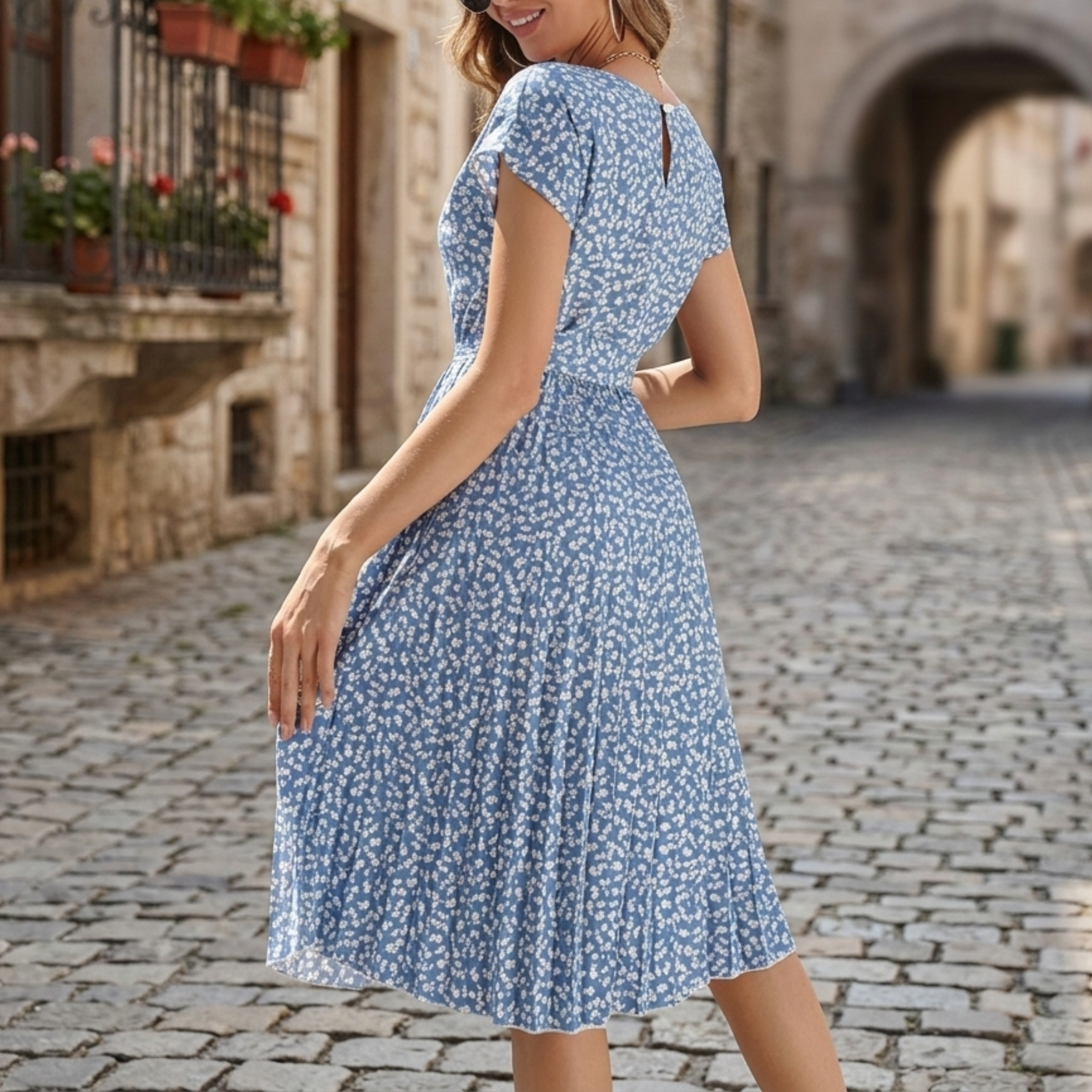Women's belted floral midi dress, close-up of floral print and belt detail