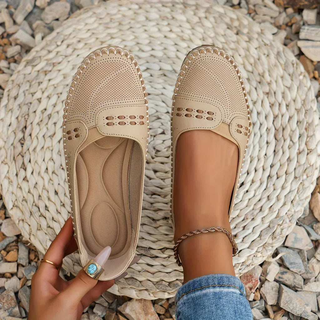 Women's flat slip-on loafers in beige, side view