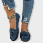Top view of women's tassel flat loafers in soft suede