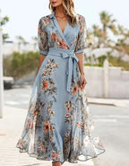 Women's romantic printed midi dress with lapel collar, flattering feminine silhouette, side view