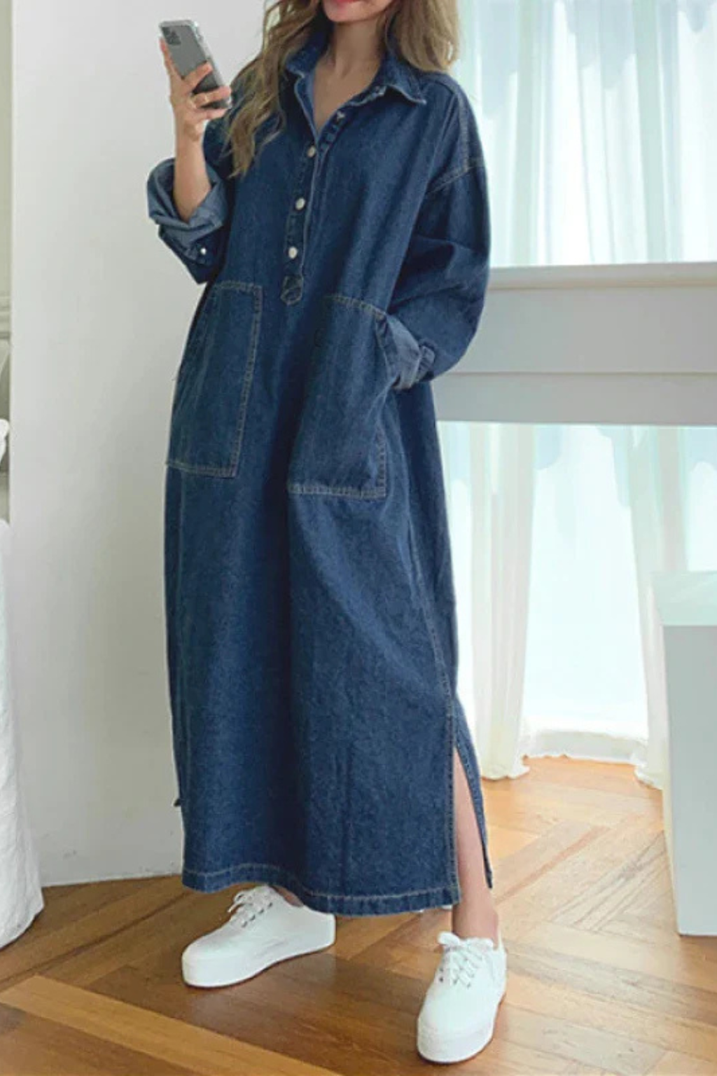 Women's long sleeve collared denim maxi dress close-up of pocket and placket detail