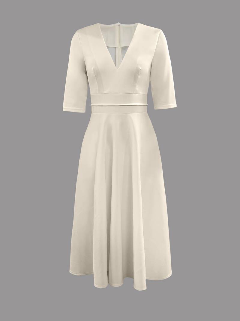 Women's wedding guest flared midi dress styled with heels
