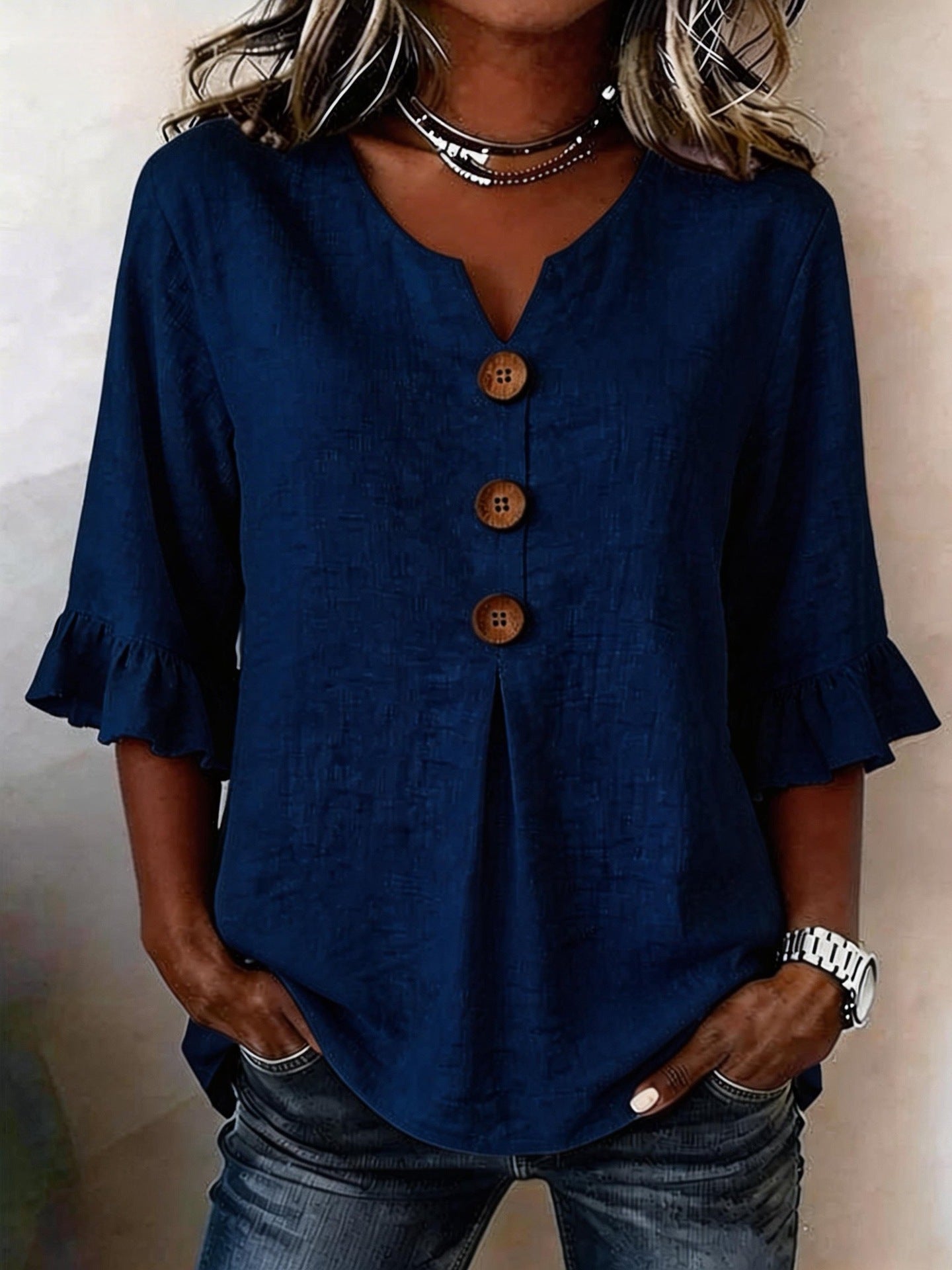 Women's ruffle blouse in dark blue, styled on model